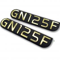 EMBLEMA TAPA LATERAL GN125F SOLPART 